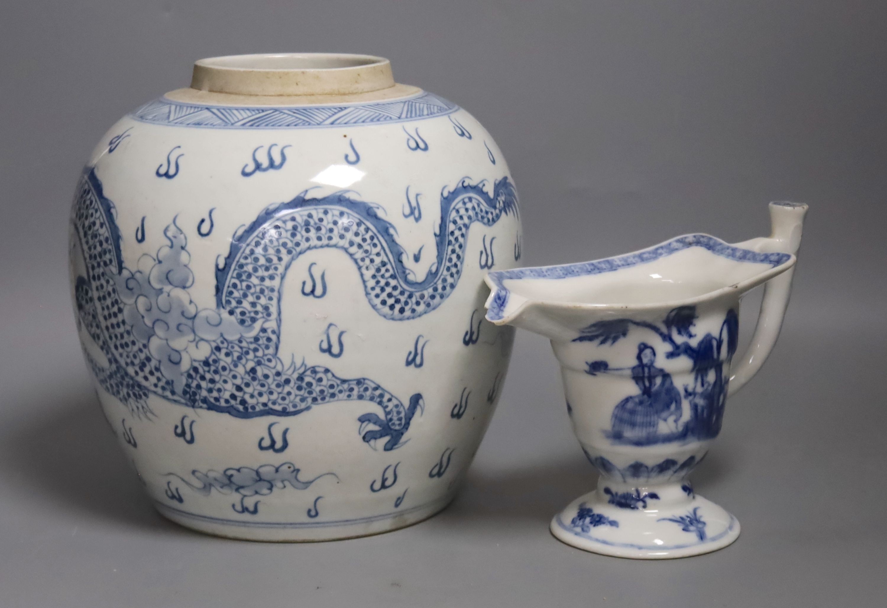 A Chinese blue and white jar, 20cm and a helmet shaped jug, 18th century and later